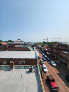 a city street with cars parked in a parking lot at Capital Hotel Annapolis in Annapolis