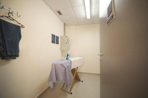 a bathroom with a sink with a towel on it at Ibis Budget Farroupilha in Farroupilha