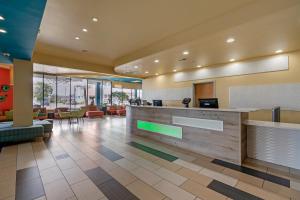 a lobby of a hotel with a reception desk at Sandcastle Resort in Virginia Beach +37 photos