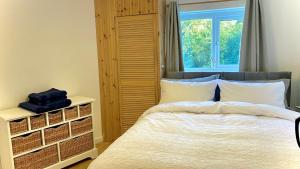 a bedroom with a bed and a window at Dove Cottage in Newbridge on Wye