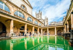 a building with a pool of water in front of it at No 12 - Stylish & homely 3 bed with parking close to city centre in Bath