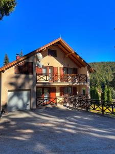 a large house with a driveway in front of it at Villa Grand Jahorina in Jahorina