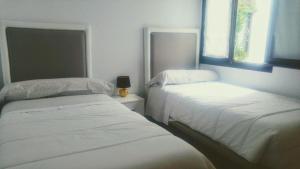 Cama o camas de una habitación en ALMAALQUILER Clavería 11