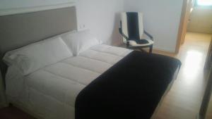 Cama o camas de una habitación en ALMAALQUILER Clavería 11
