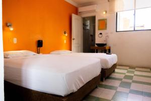 Säng eller sängar i ett rum på Hotel Miami SM
