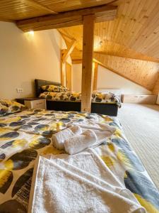 a bed in a room with two twin beds at My sweet home Jahorina in Jahorina