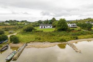 an aerial view of a house and a river at Cottage 431 - Oughterard in Oughterard