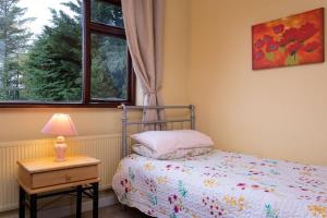 Voodi või voodid majutusasutuse Cottage 431 - Oughterard toas