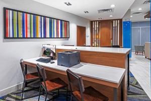an office with a desk with a computer on it at Holiday Inn Express & Suites - Stafford NW - Sugar Land, an IHG Hotel in Stafford