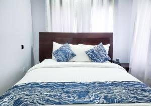 Ένα ή περισσότερα κρεβάτια σε δωμάτιο στο Medallion Hotels