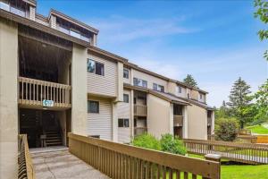 a building with a wooden fence in front of it at Pinnacle C10 in Killington