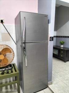 a stainless steel refrigerator in a kitchen at Yuyu homestay in Johor Bahru