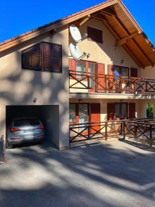 a car parked in front of a house at Villa Grand Jahorina in Jahorina