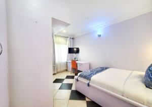 Ένα ή περισσότερα κρεβάτια σε δωμάτιο στο Medallion Hotels