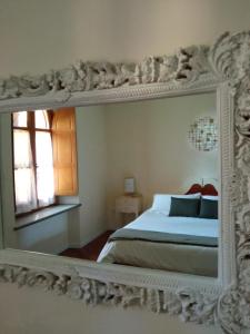 Postel nebo postele na pokoji v ubytování San Bartolomeo Suite