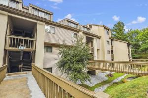 an apartment building with a balcony and a fence at Pinnacle A11 in Killington