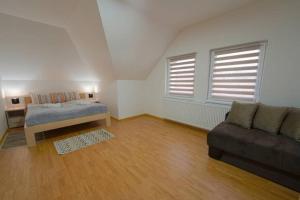 A bed or beds in a room at Apartman Luka
