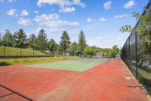 a tennis court with a tennis racket on it at Pinnacle E10 in Killington