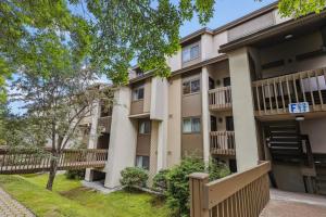 an apartment building with balconies and trees at Pinnacle F01 in Killington