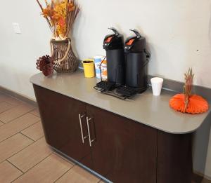 a counter with a coffee maker on top of it at Motel 6-Tucson, AZ-Downtown in Tucson