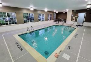 a large swimming pool in a hotel room at Super 8 by Wyndham Smithfield-Selma in Smithfield