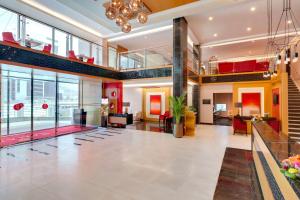 a large lobby with a large room with a lobby at Ramada Hotel and Suites Amwaj Islands in Manama