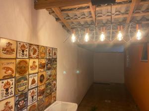 a room with a toilet and some pictures on the wall at Casa em Bertioga condomínio 200 metros da praia in Bertioga +36 photos