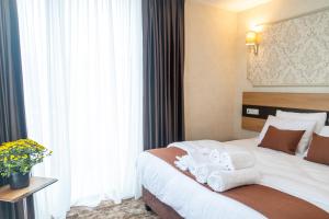Letto o letti in una camera di Hotel Solum Roof Top