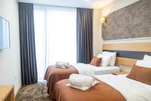 Letto o letti in una camera di Hotel Solum Roof Top