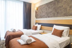 Letto o letti in una camera di Hotel Solum Roof Top