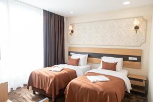 Letto o letti in una camera di Hotel Solum Roof Top