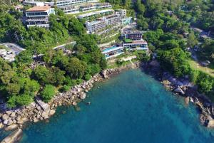 an aerial view of a resort next to a body of water at Zenmaya Oceanfront Phuket, Trademark Collection by Wyndham in Patong Beach