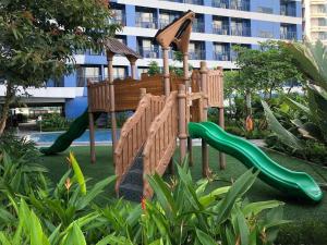 a playground in a park with a slide at Azure south urban beach resort near airport in Manila