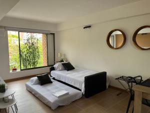 Voodi või voodid majutusasutuse Poblado Park Apartamento-Estudio toas