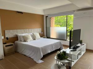 Voodi või voodid majutusasutuse Poblado Park Apartamento-Estudio toas