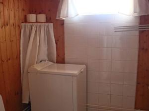 a bathroom with a washing machine and a window at 4 person holiday home in SKÅNES-FAGERHULT-By Traum in Slättsjö +21 photos