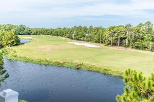 Luftaufnahme eines Golfplatzes mit einem Fluss in der Unterkunft St James Golf Resort 331 Penthouse 3/3 sleeps 8 gated pool 1dog ok in Big Blackjack Landing