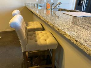 a bar stool at a counter in a bathroom at 10 min airport 15 min PD Canyon in Amarillo