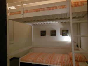 a bedroom with two bunk beds in a room at Kodaly Art Apartment in Budapest