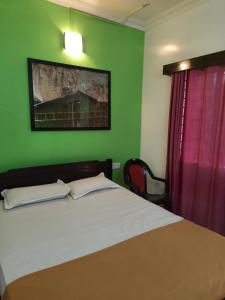 Postel nebo postele na pokoji v ubytování Cherry blossom guest house + 9 fotografií