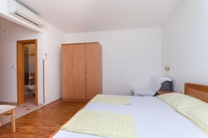 Posteľ alebo postele v izbe v ubytovaní Apartments Josip S