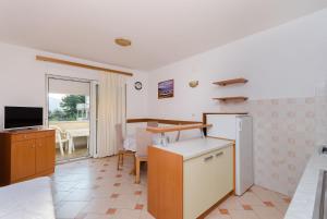 Televízia a/alebo spoločenská miestnosť v ubytovaní Apartments Josip S