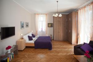 a living room with a bed and a tv at Apartment Mario in Split