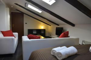 Un pat sau paturi într-o cameră la Olimpico