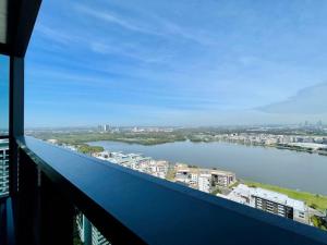 a view of a river from the balcony of a building at New Luxury stunning water view 2bed2bath Condo in Sydney