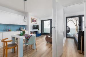a kitchen and living room with a table and chairs at Rewal Hevenia The Best View ever in Rewal