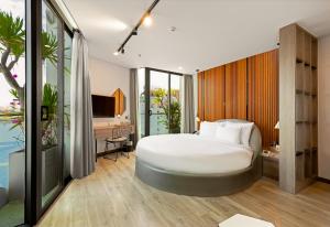 Postel nebo postele na pokoji v ubytování HAIAN Riverfront Hotel Da Nang + 37 fotografií