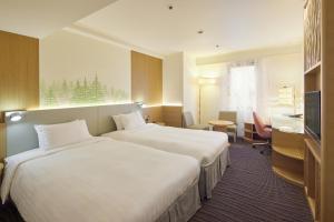 Postel nebo postele na pokoji v ubytování Kichijoji Excel Hotel Tokyu + 36 fotografií