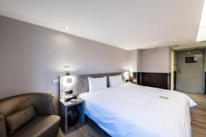 Hub Hotel - Songshan Airport Branchにあるベッド