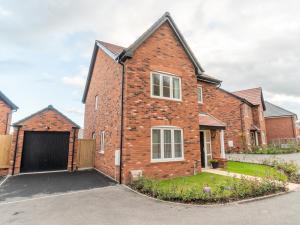 a brick house with a garage at Pass the Keys Centrally located beautiful 3 bed new build home in Nottingham